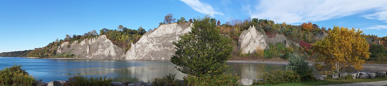 The pale cliffs of the Scarborough Bluffs meeting the lake